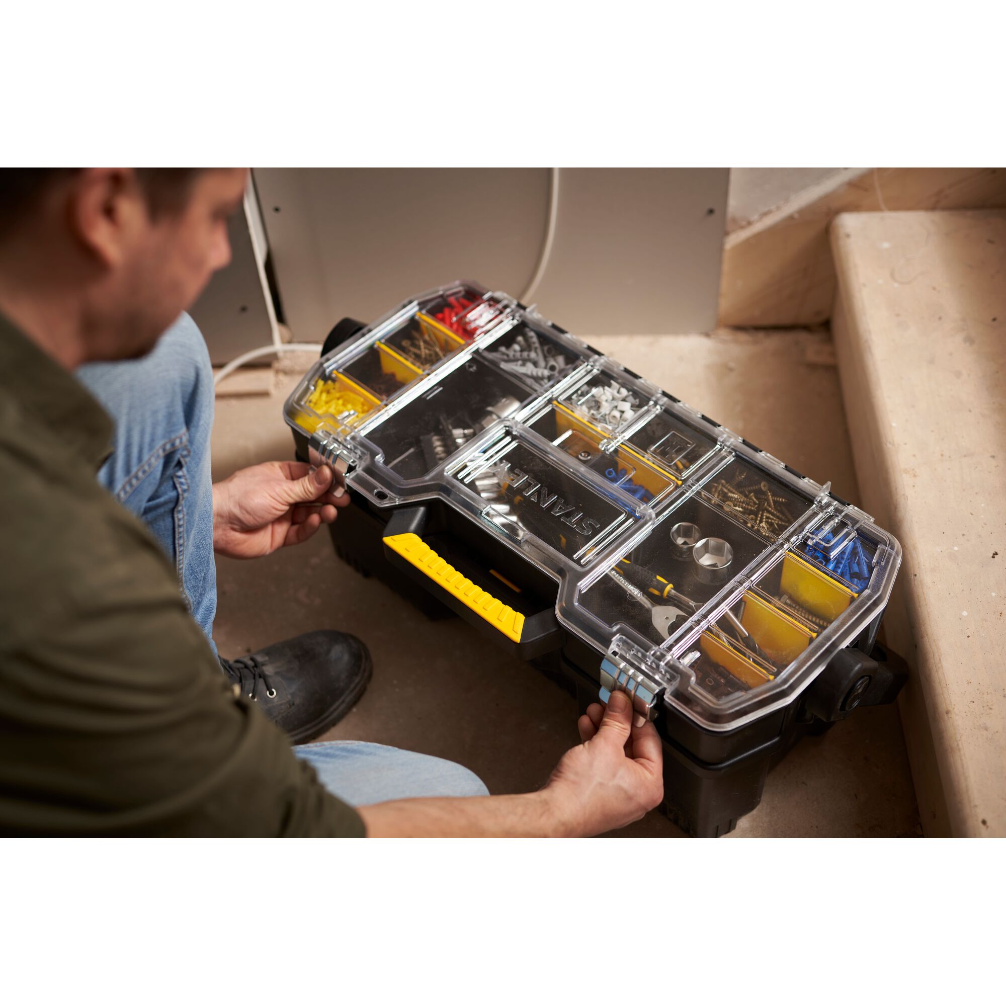 STANLEY 1-97-514 organizer box with clear lid, yellow handle, compartments with hardware, used on site.